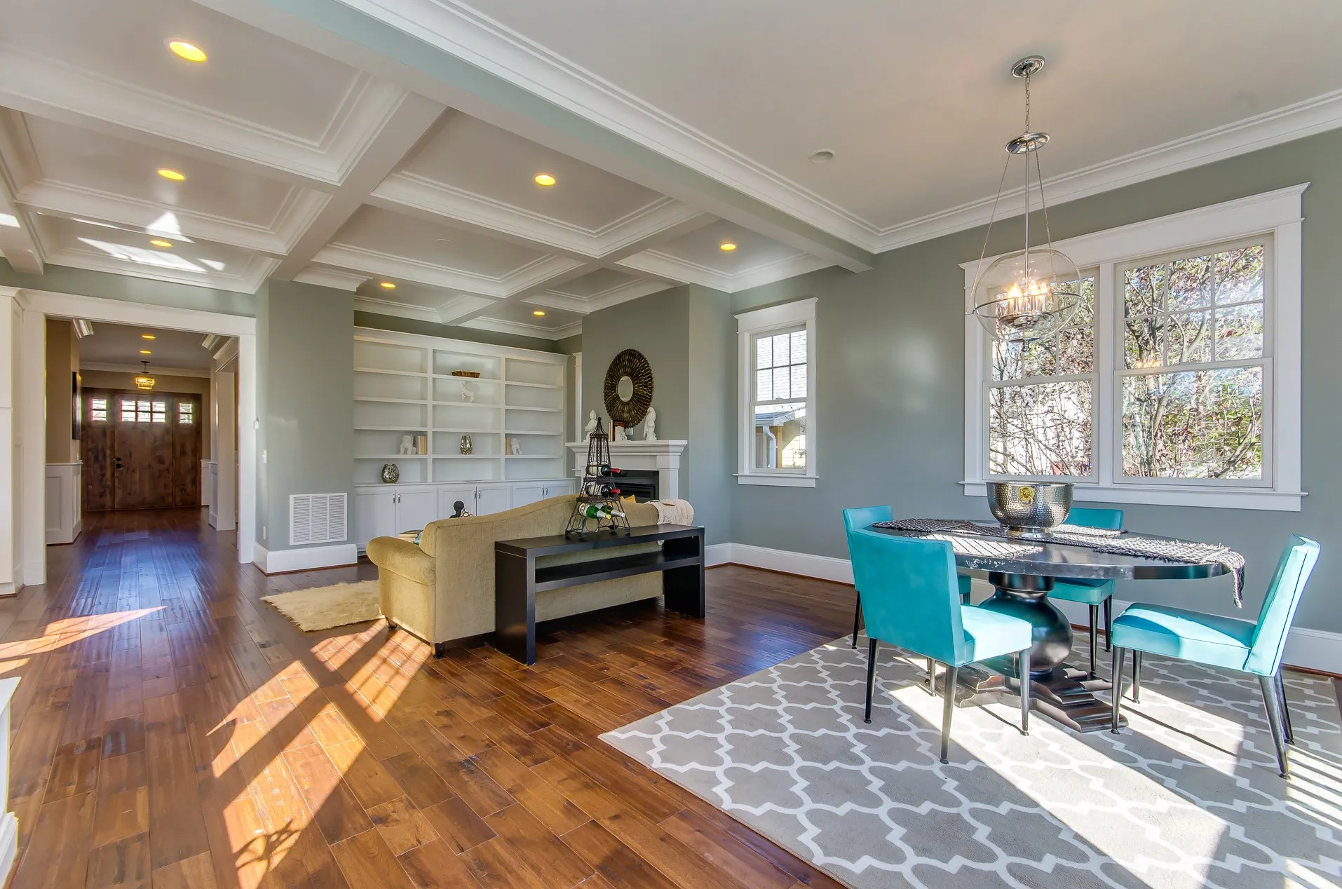 Family room with hardwood floors and built-in shelving