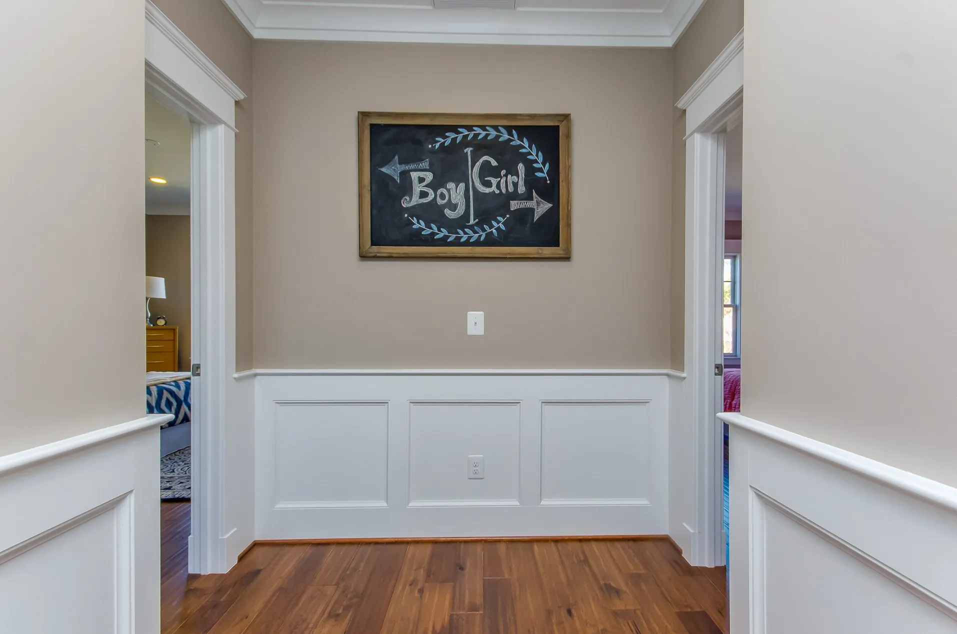 Hallway with custom wall paneling and fresh paint