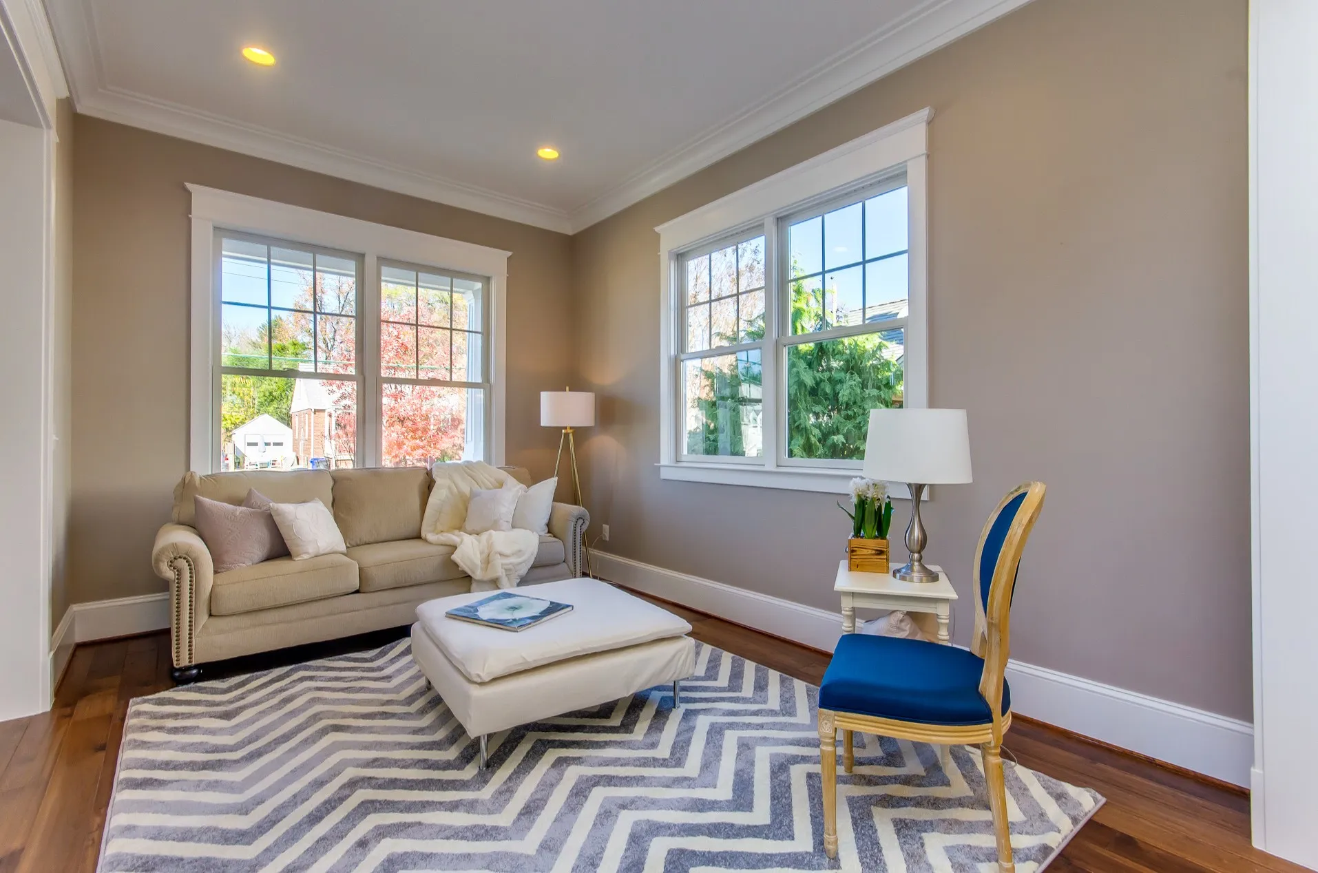 Finished living room with fresh paint, trim work and hardwood floors